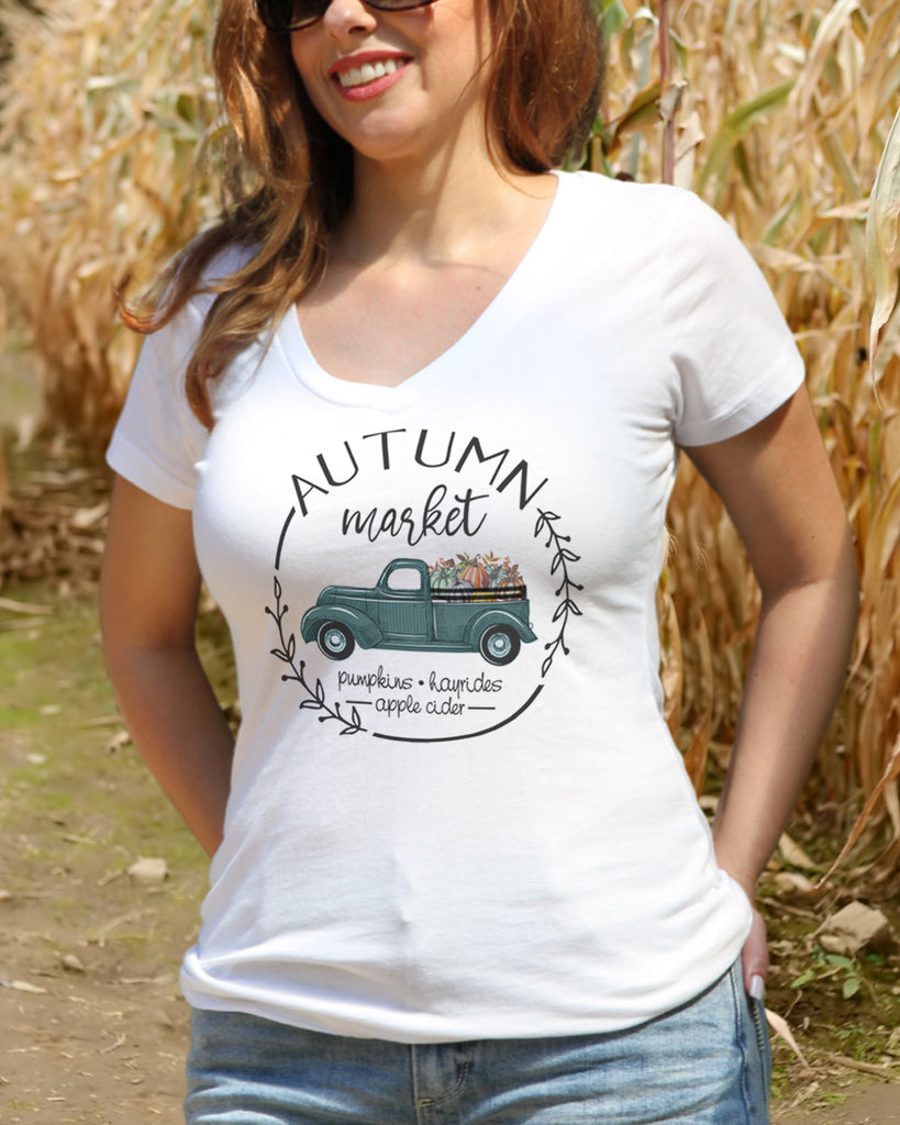 Up close model wearing white "Autumn Market" v neck - It's Your Day Clothing