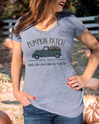 Up close model wearing "Pumpkin Patch" heather gray v neck - It's Your Day Clothing